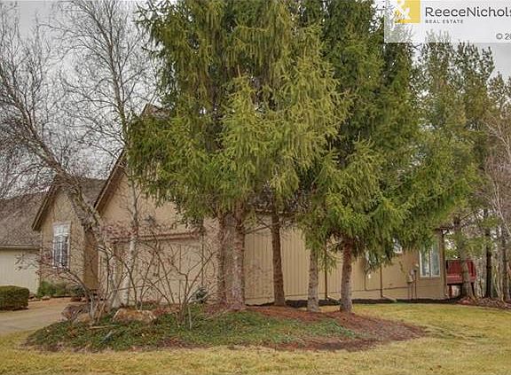 Landscaped home surrounded by trees