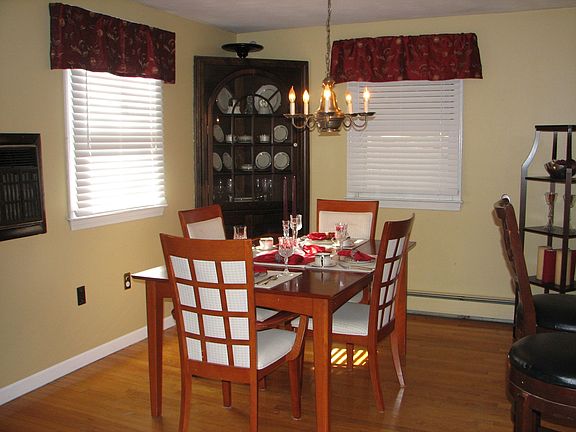 The dining area is open to the kitchen and living room