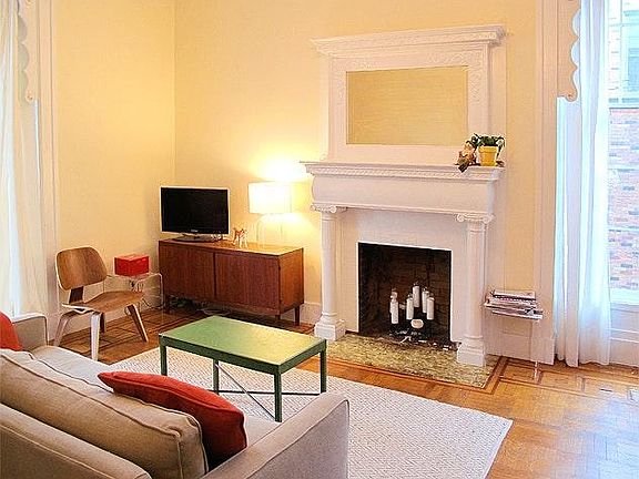 large living room with fireplace and parquet inlaid flooring
