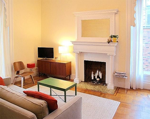 large living room with fireplace and parquet inlaid flooring