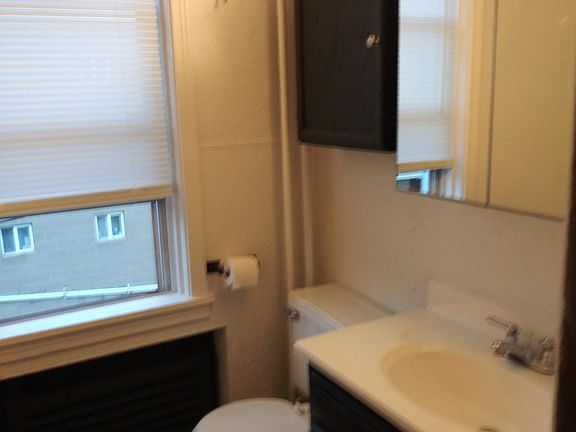Bath with vanity, cabinet, and tub/shower