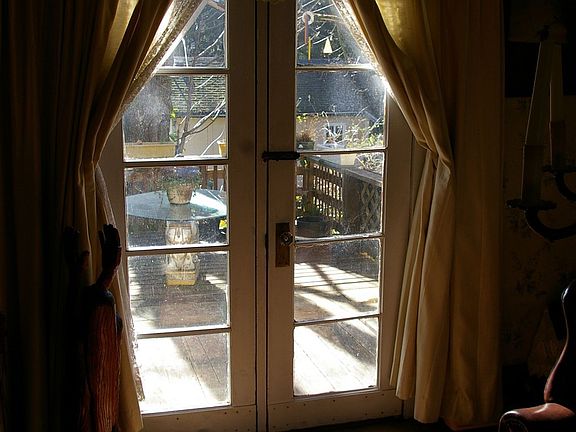 French doors in parlor lead to deck and rear yard