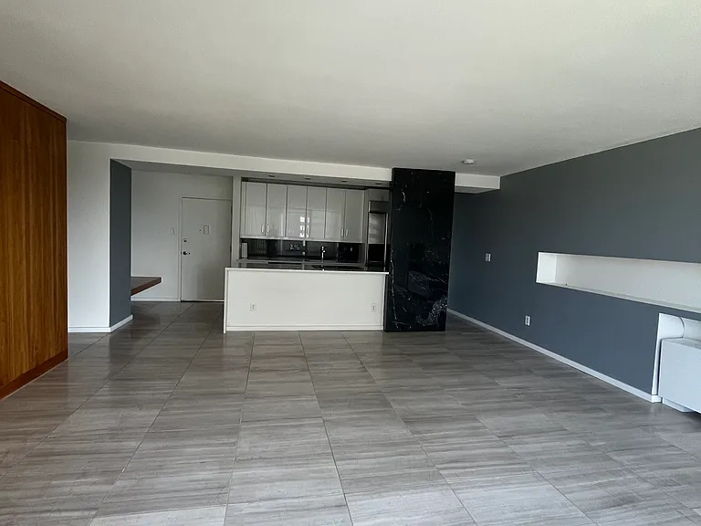 Large living room with travertine floors, huge open kitchen