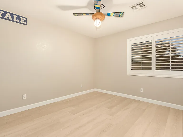 Bright Upstairs Bedroom Overlooking the Front Yard.