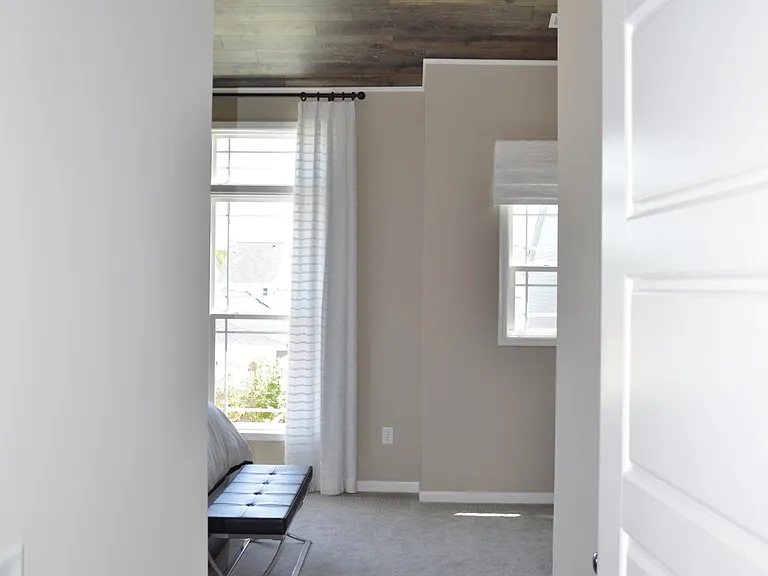 A short hallway leads into the master bedroom with a walk-in closet directly on the right.
