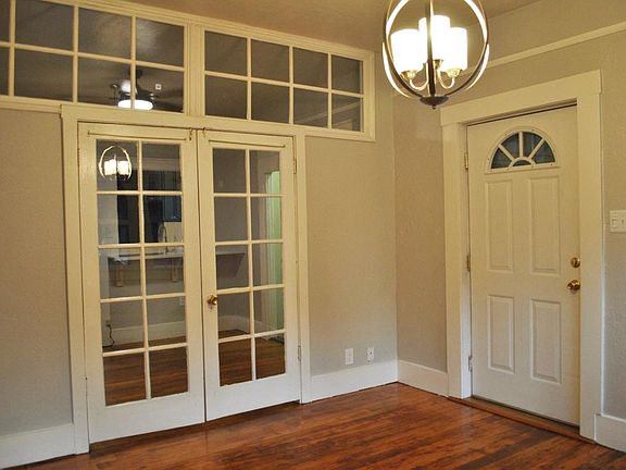 Front door. View into the front room. Glass doors lead to the second living area