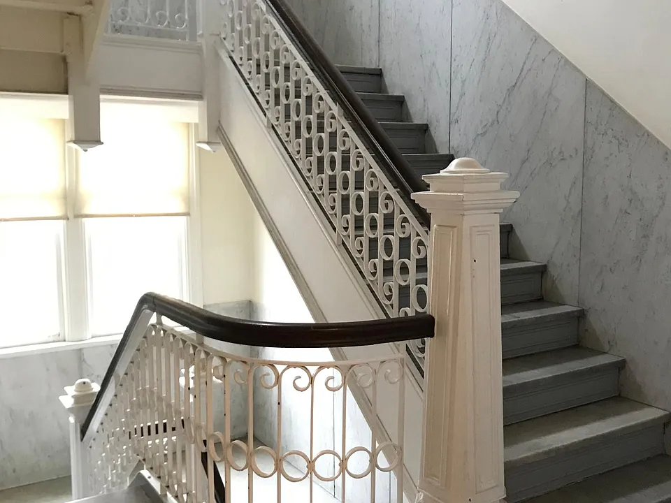 Inside, there are marble steps and tile work on the landings.