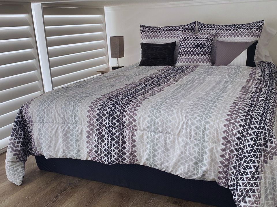 The studio offers a comfortable queen-size bed for a restful stay. Lakeland, FL