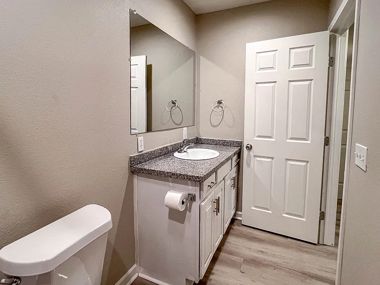 Another view of the updated second bath, conveniently located near both secondary bedrooms and the laundry area.