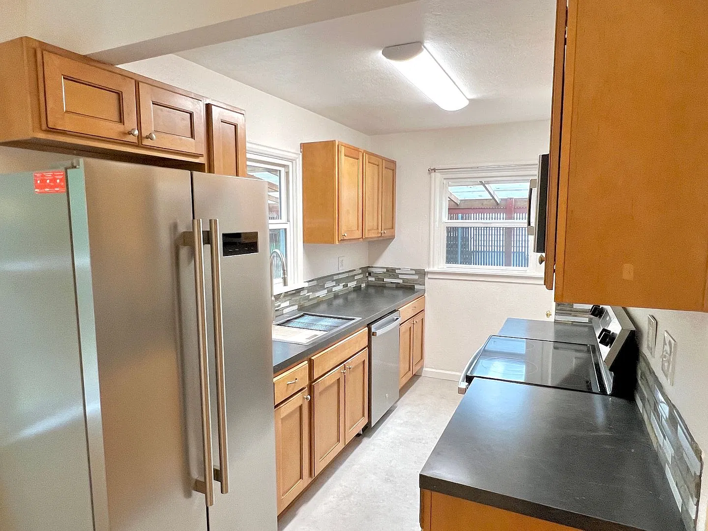 This beautifully updated home offers a bright and inviting atmosphere with modern amenities and u... — Photo 4