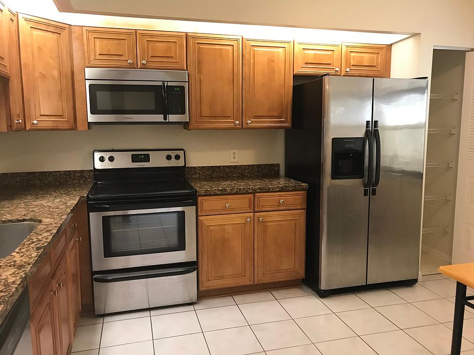 Updated kitchen featuring stainless steel appliances and granite countertops.