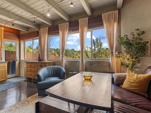With lift-top coffee table raised as a desk or for dining.