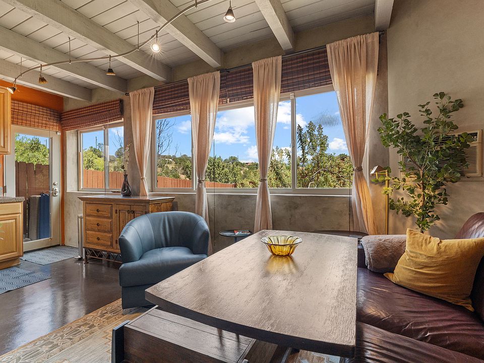With lift-top coffee table raised as a desk or for dining.