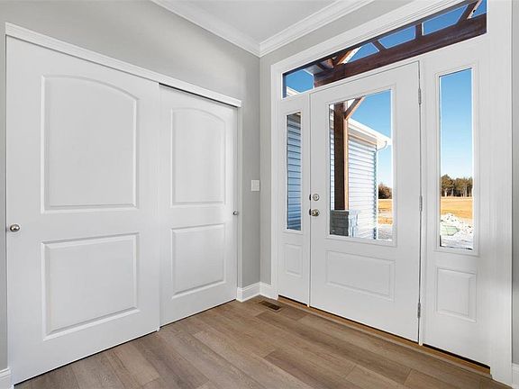 Standard Entry foyer with glass front door transom and side lites.
