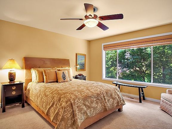 A canopy of trees outside the master. Walk in closet and private bath.