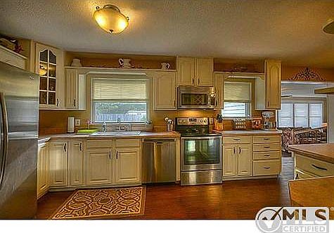 Updated kitchen with stainless appliances.
