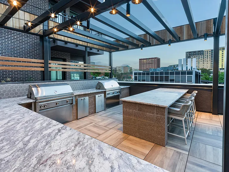 Gather friends and elevate your evenings at Modera Golden Triangle's rooftop outdoor kitchen.