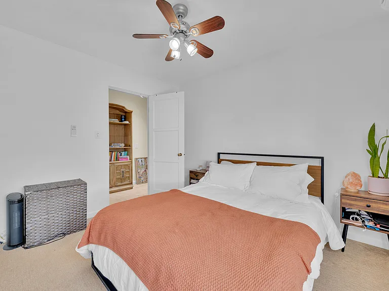 Rear bedroom carpeted, ceiling fan adjustable speed and lighting