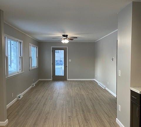 Living room/front door entrance (view from kitchen)