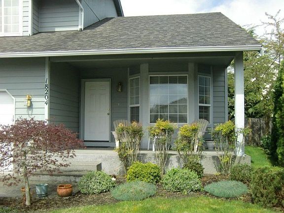 Charming front porch is a perfect place for iced tea on a lazy summer afternoon!