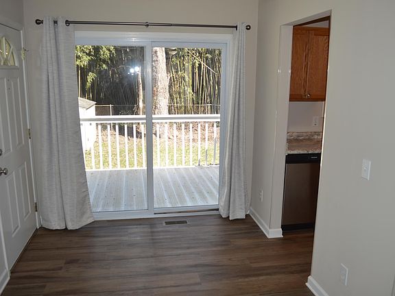 Dinette area adjacent to kitchen with sliding glass door out to deck and private back yard