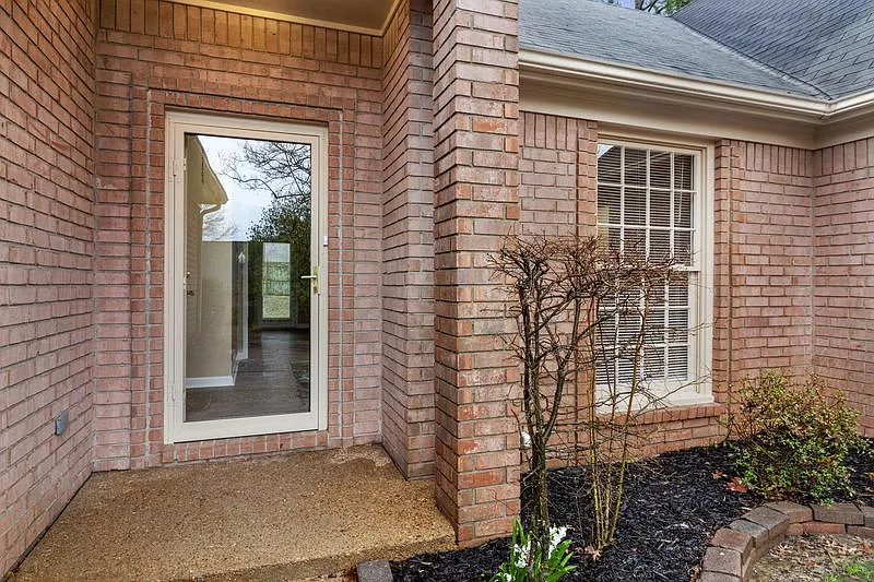 3-Bedroom Brick Home with Fireplace, Primary Suite & Fenced Backyard — Photo 3