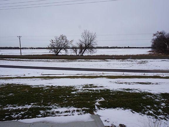 Sliding glass door from the kitchen leads to a patio and backyard that has access to trail system.