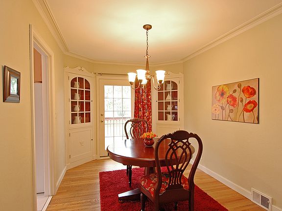 Elegant dining room with matching built-in hutches