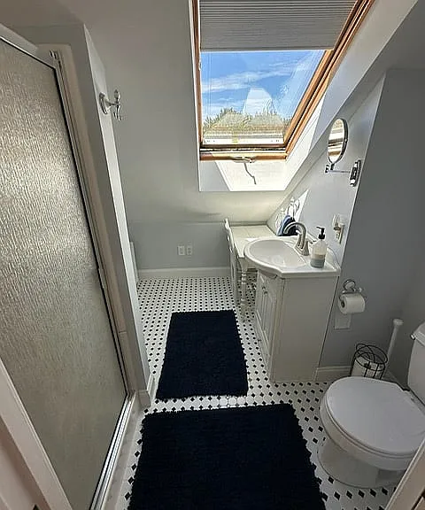 Fourth floor ensuite bathroom in loft has a lovely skylight.