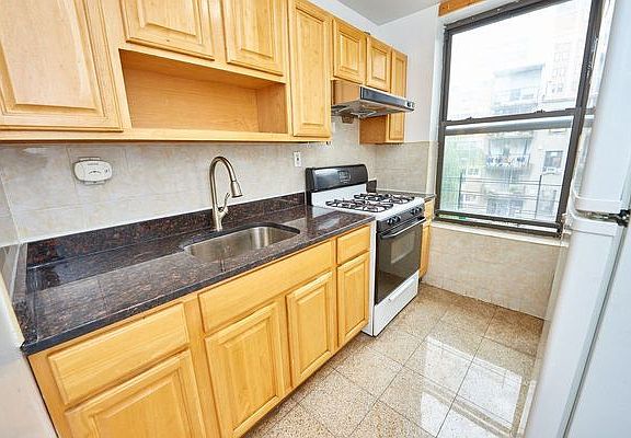 5th image of 213 E Broadway APT 1