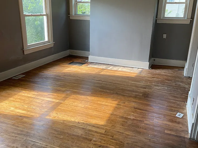 Living Room with Original Hardwood Floors taken from Front Entryway