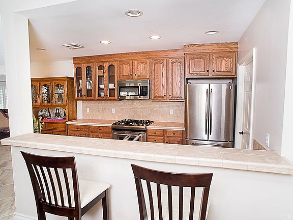 The kitchen area with breakfast bar, recessed ligh