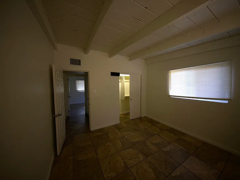 Example bedroom. All bedrooms have large closets with shelves and poles for hanging shirts, dresses, etc.