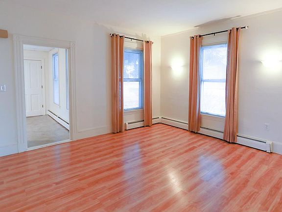 Livingroom with large windows allowing for lots of natural light.
