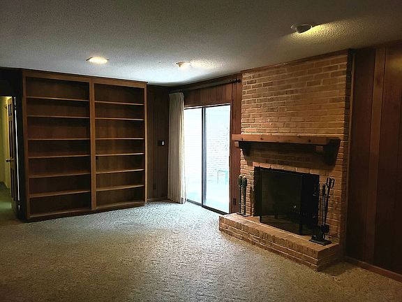 Spacious den, wood fireplace