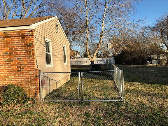 South side of yard, chain link fence surrounds side and back