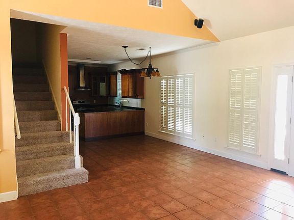 Open concept layout-den into the kitchen