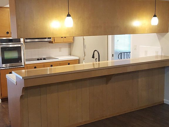 Eating bar open to family room/kitchen/breakfast nook.