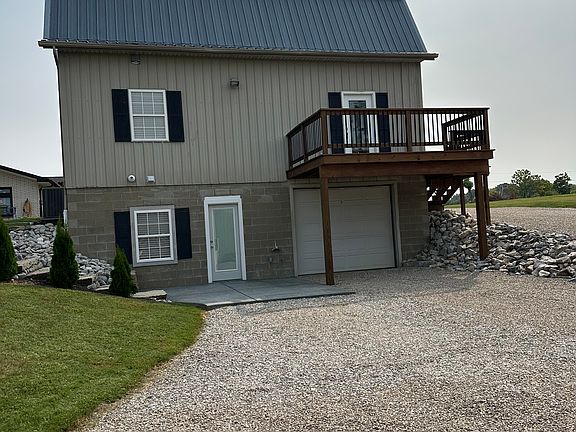 Back of home deck walk out basement patio drive in garage