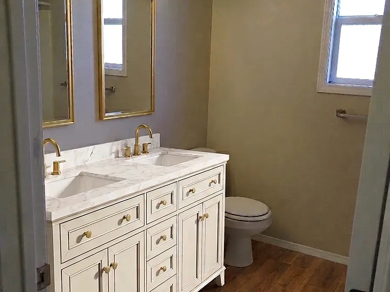 Master bathroom (new flooring and vanity pictured)