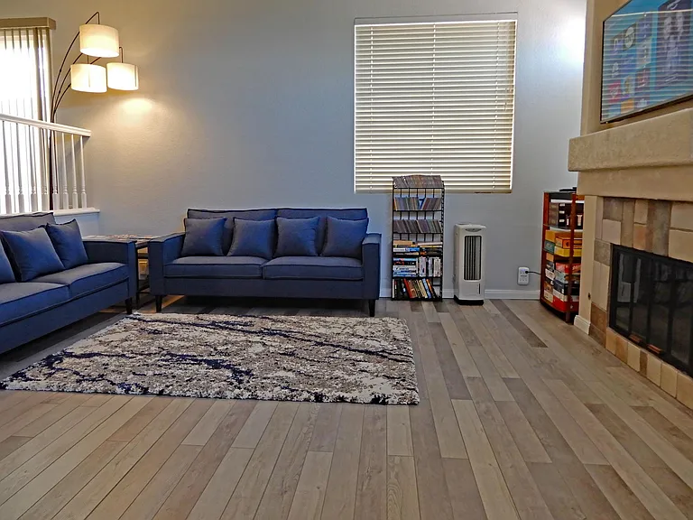 Enter newly updated Living Room. New Flooring and Furniture. 50" Smart TV.