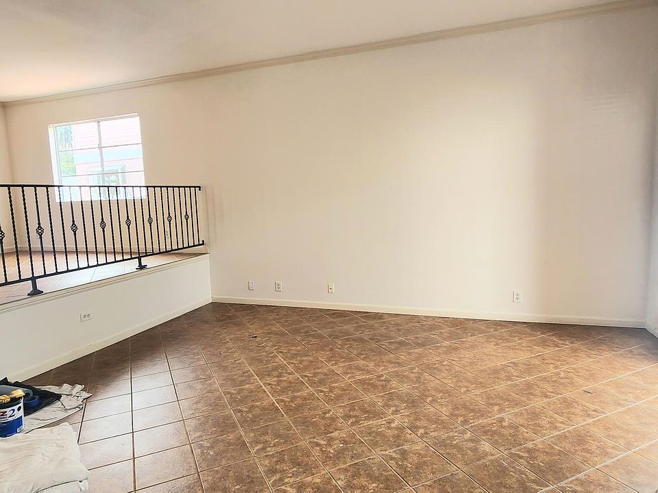 Freshly painted living room and dining room. Later photos show it furnish