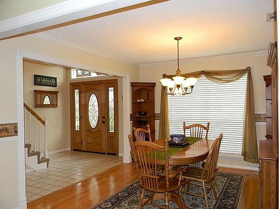 View of entry from living room. Wall between both living & dining has been removed.