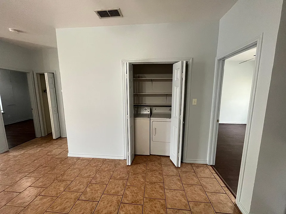 Washer/Dryer connections in utility closet.