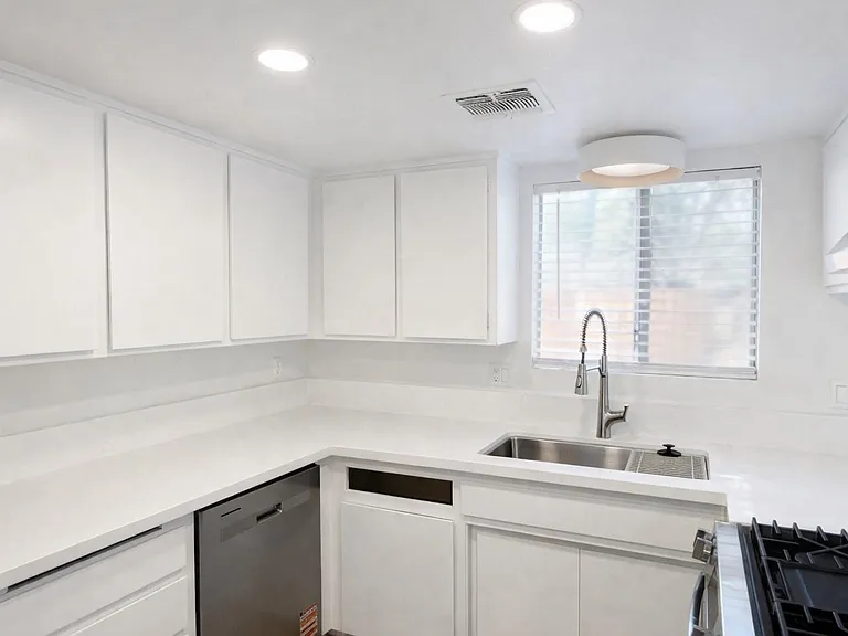 New Kitchen with quartz counters and stainless appliances
