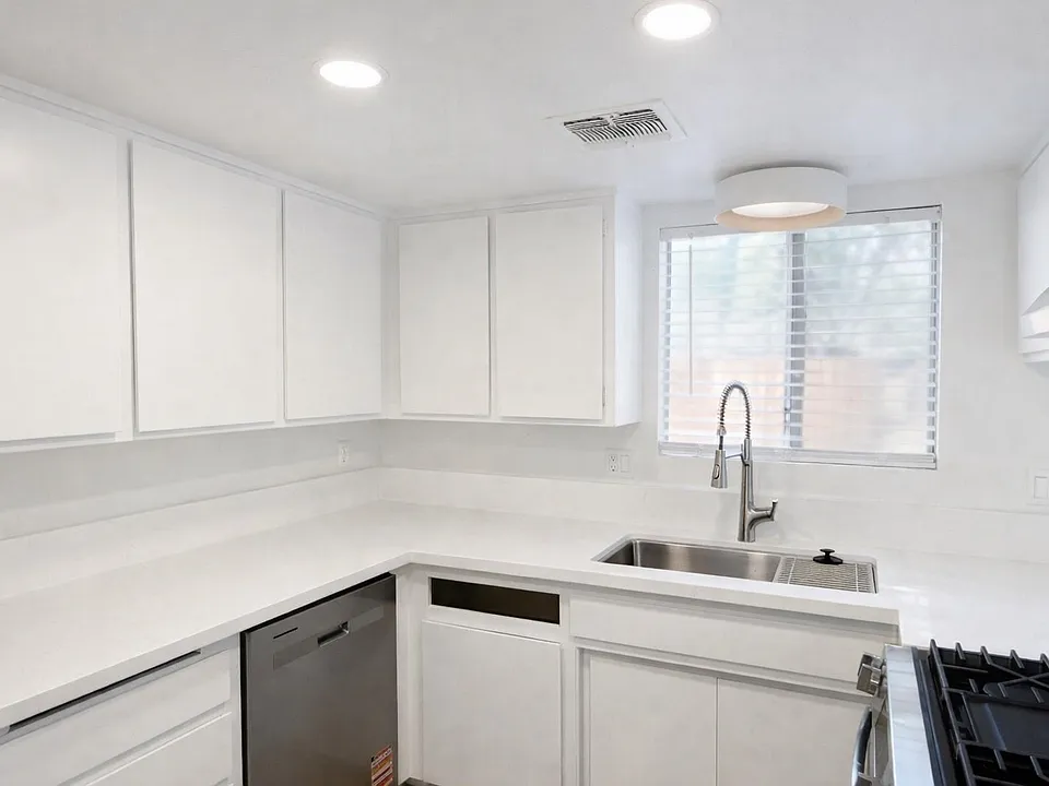 New Kitchen with quartz counters and stainless appliances