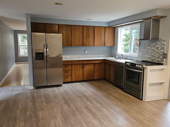 Open kitchen with living room beyond.
