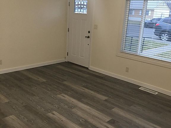 Entry room with brand new floors.