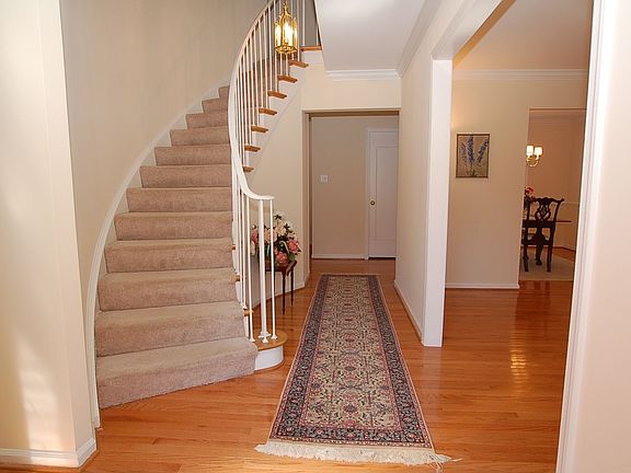 Grand Curved Stairway Entry