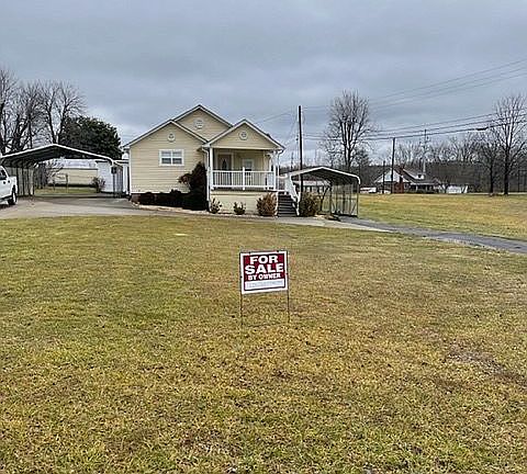 circle drive & 2 carports 